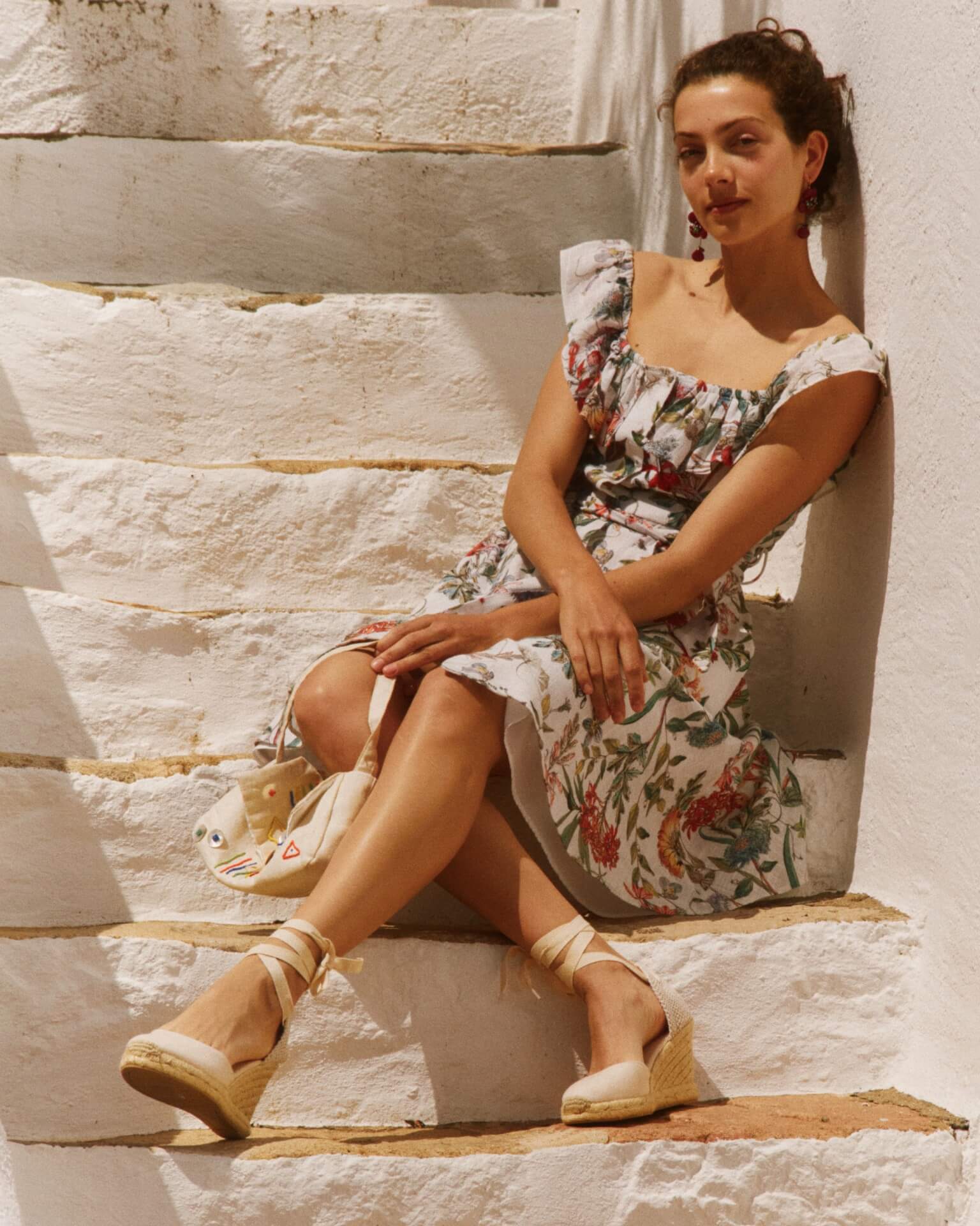 Woman sitting in white shoes