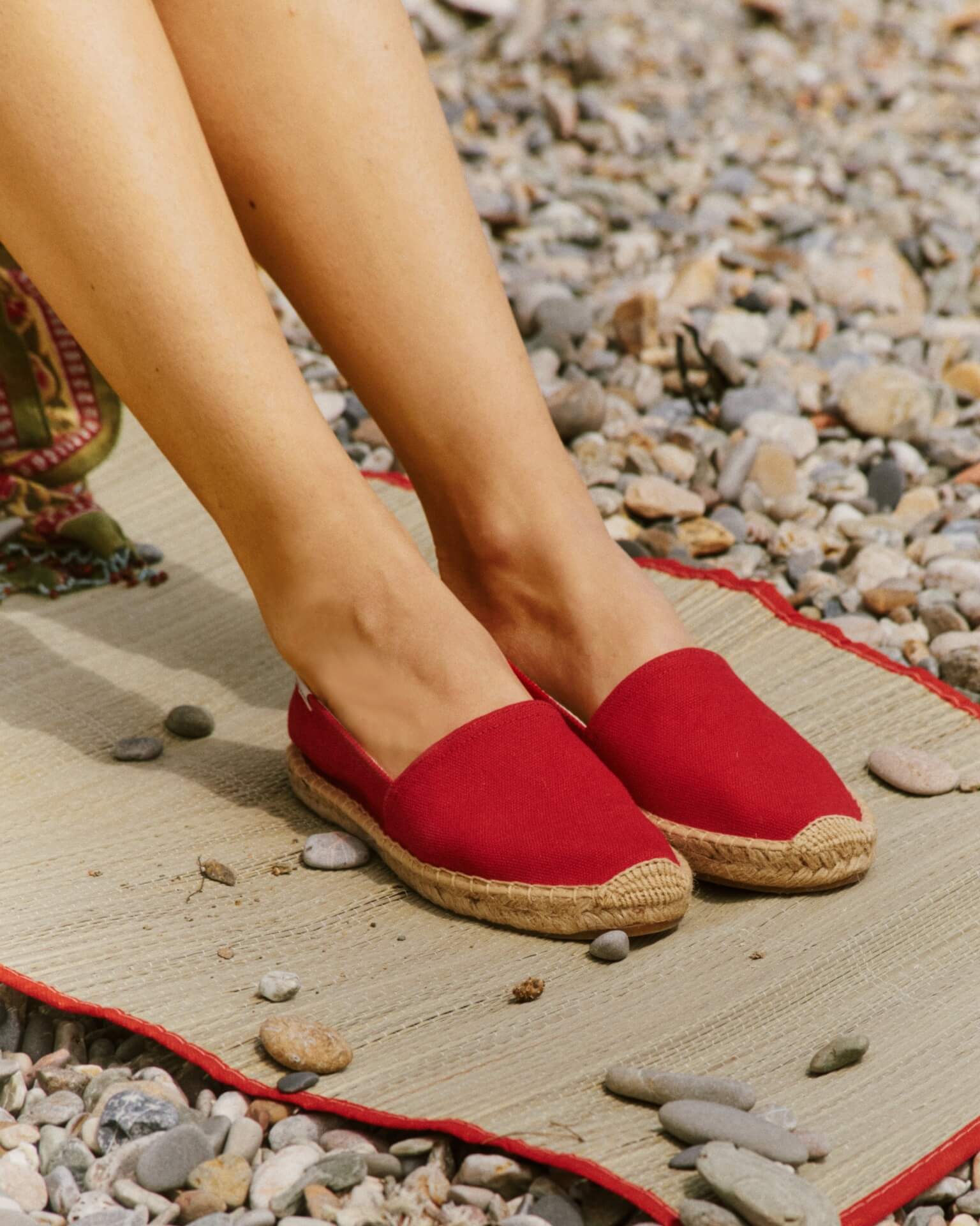 woman sitting in red shoes